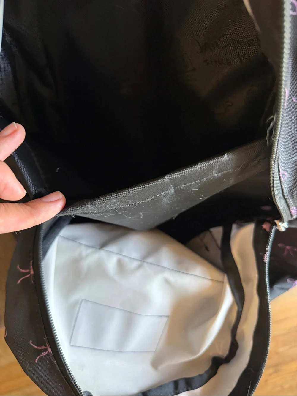 Jansport Black Backpack with Pink Bow Print